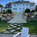 back view of buckley home with hardscaping
